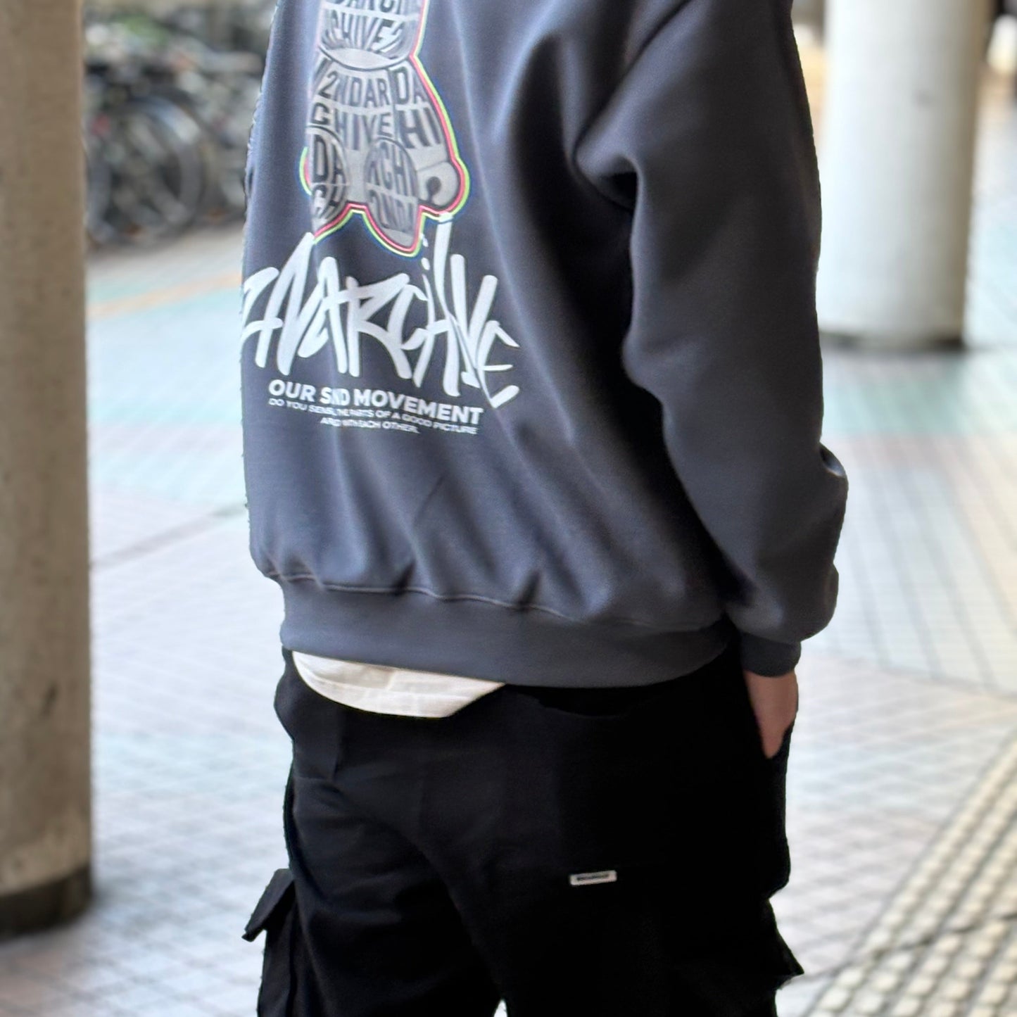 model wearing bear graphic sweater