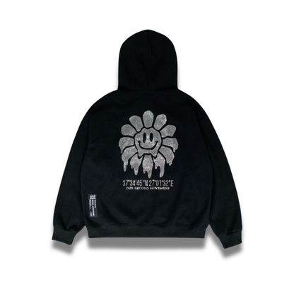 背面にスマイルフラワーのスタッズデザインが入ったジップアップパーカーの正面写真