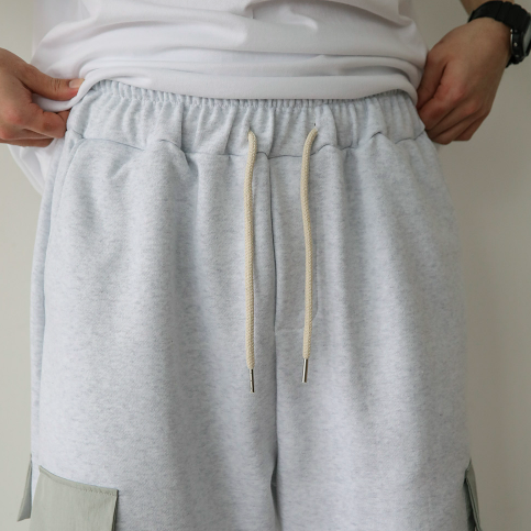 Light gray joggers, cargo pocket, unisex, adjustable.