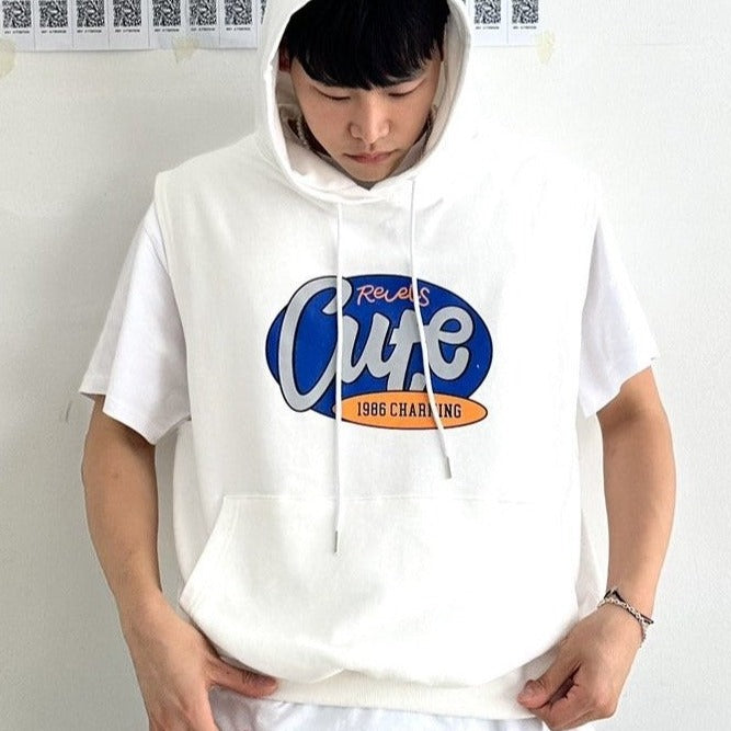 Model wearing a white sleeveless hoodie with the word "Cute" printed ion the chest. 