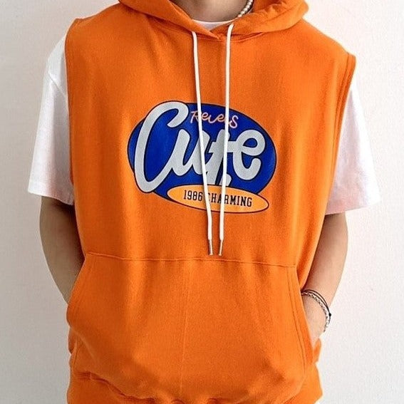 Close up of a model wearing an orange sleeveless hoodie with cute English letting printed. 