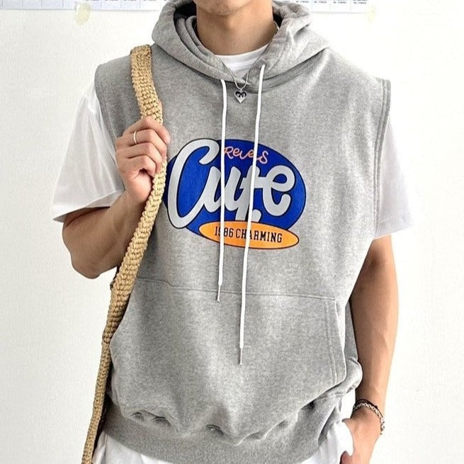 Close up of a Korean street fashion sleeveless hoodie worn by a Korean model with English lettering printed on the chest. 