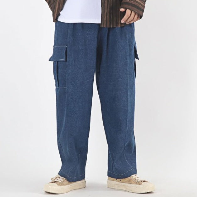 Street fashion, blue oversized denim cargo pants.