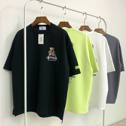 Front facing graphic t shirts made in Korea hanging on rack. 