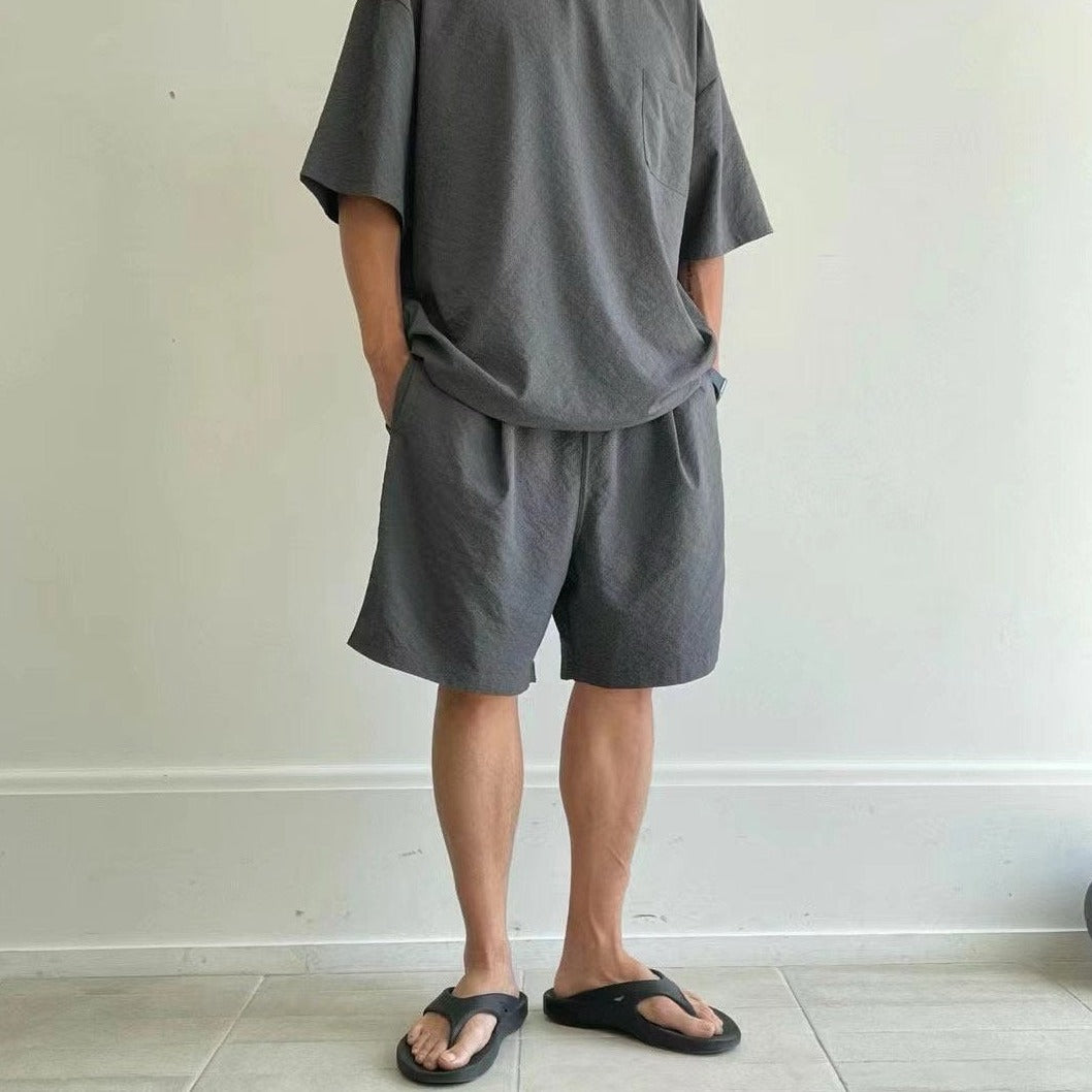 Fashionable gray t shirt and shorts set for summer. 