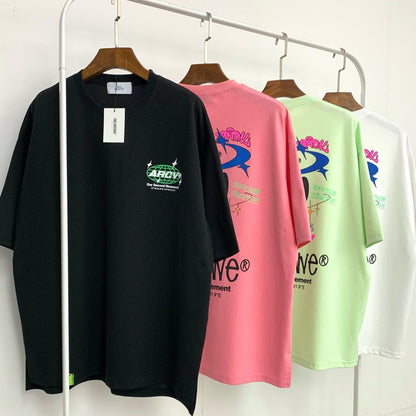 4 colors of graphic t-shirts hanging. 