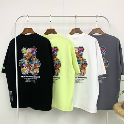 four graphic t shirts with four color options hanging on a rack. 