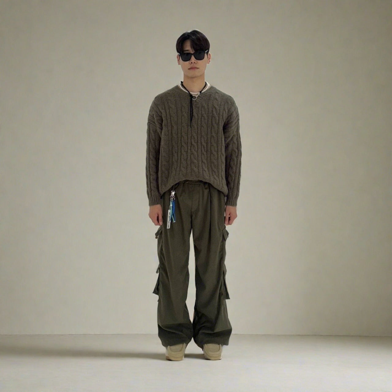 These Korean-made cargo pants redefine urban style with their oversized design and eye-catching black, gray, and brown hues.