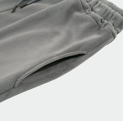 Up close view of street fashion corduroy pants with pocket and adjustable waist.  