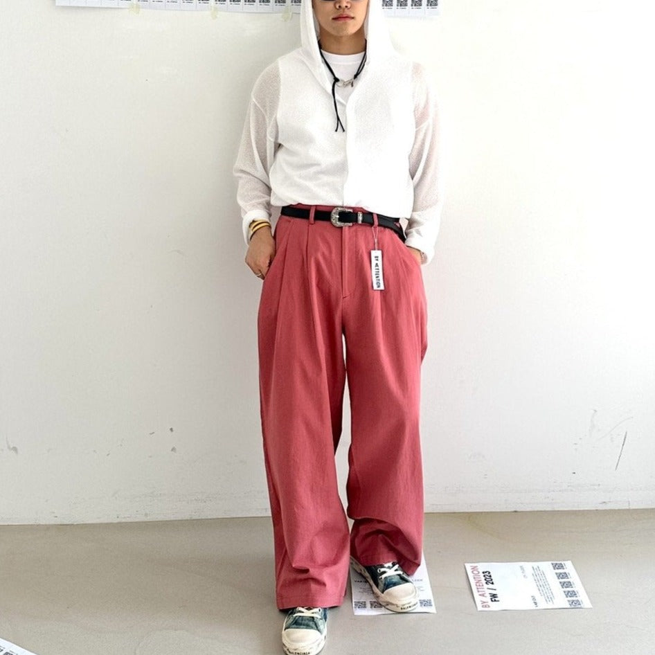 Salmon-colored Korean street slacks, oversized.