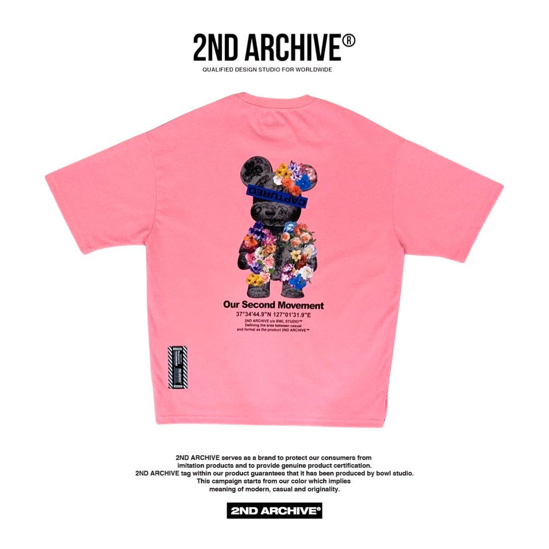 Pink t-shirt with cool flower teddy bear graphic. 