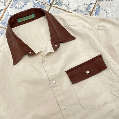 Elegant vintage button-up shirt, unisex, streetwear inspired.