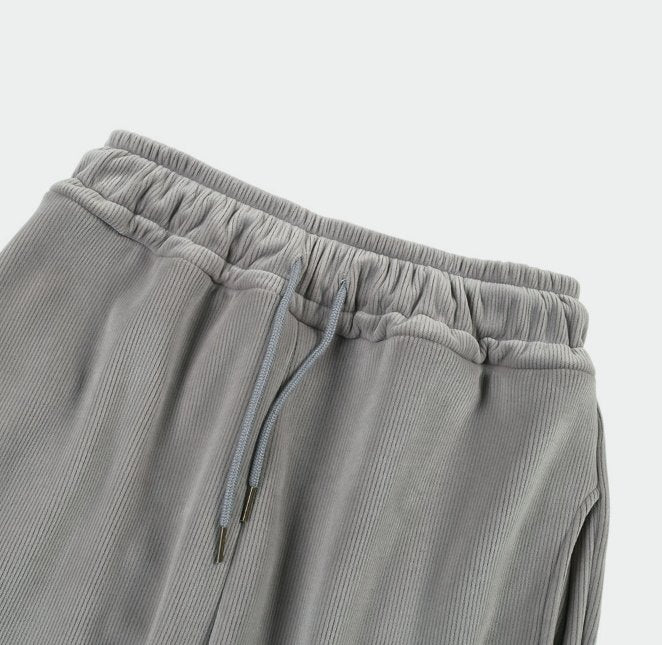 zoom view of adjustable waist band on Korean street fashion gray pants. 