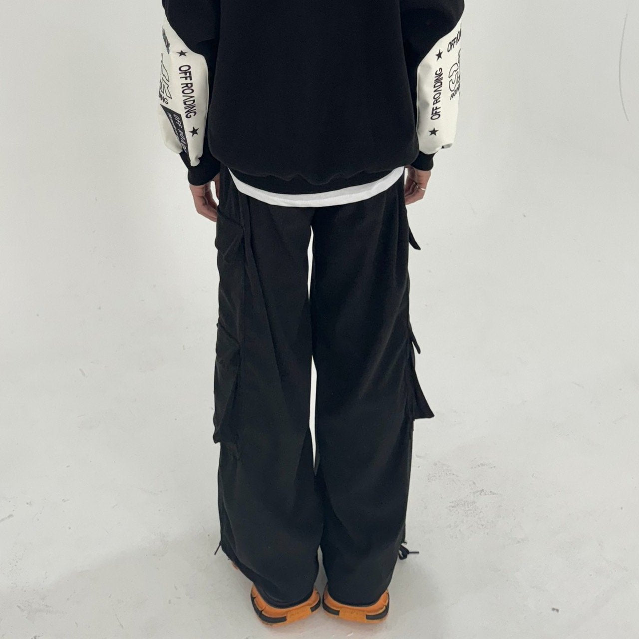 Get noticed in these Korean-designed cargo pants, featuring an oversized fit and a captivating mix of black, gray, and brown shades.