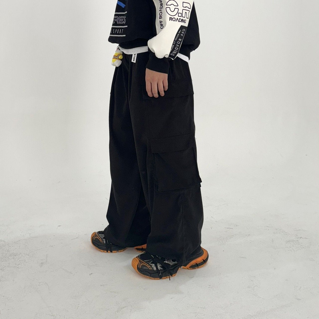 Elevate your street cred with these oversized cargo pants from Korea, showcasing a unique color combination and a fashion-forward silhouette.