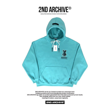 Mint color hoodie with small bear graphic on the front. 