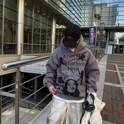 Gray hoodie with intricate spider web.