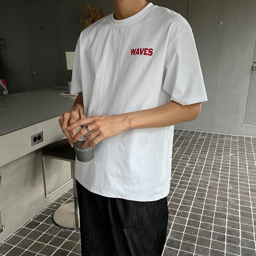 Korean-made white t shirt with English writing on front. 