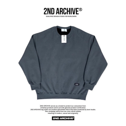 Front facing dark gray sweater with small logo made in Korea. 