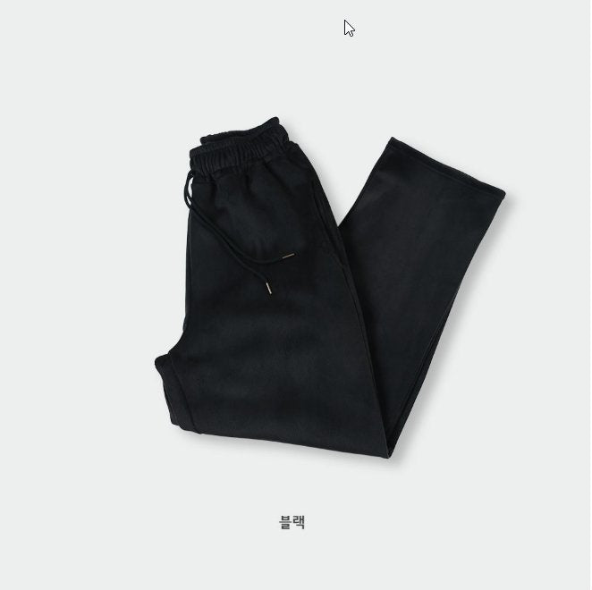 Black winter pants with adjustable waist band and microfiber material. 