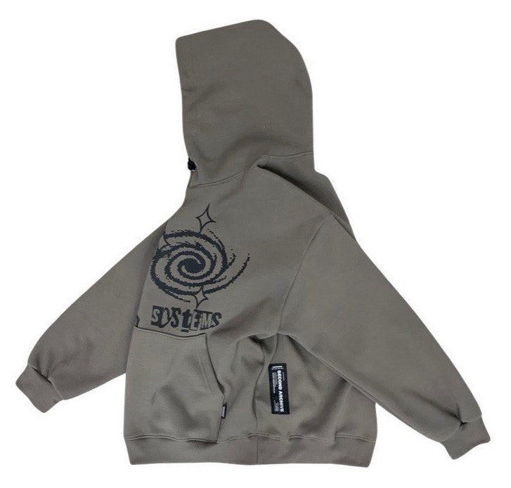 Side view of khaki hooded sweater with graffiti style graphic on front. 