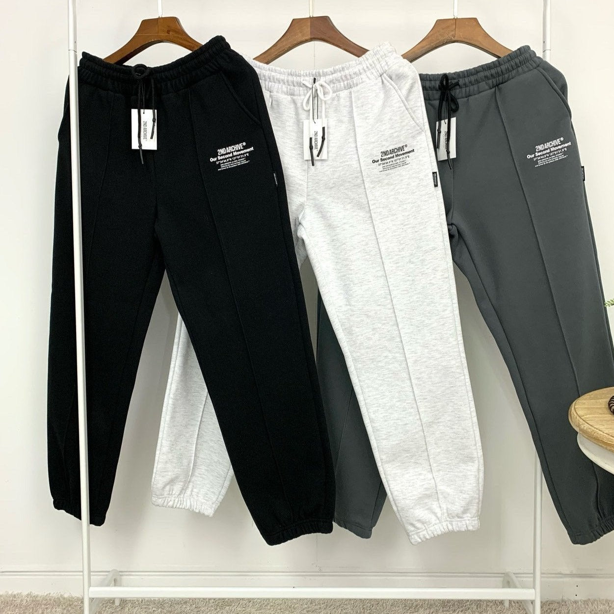 black, light gray and dark gray jogger sweatpants. 