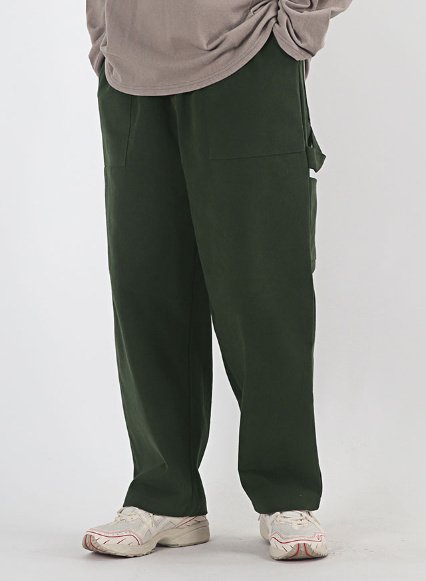 Green Korean regular fit pants, stylish carpenter design.