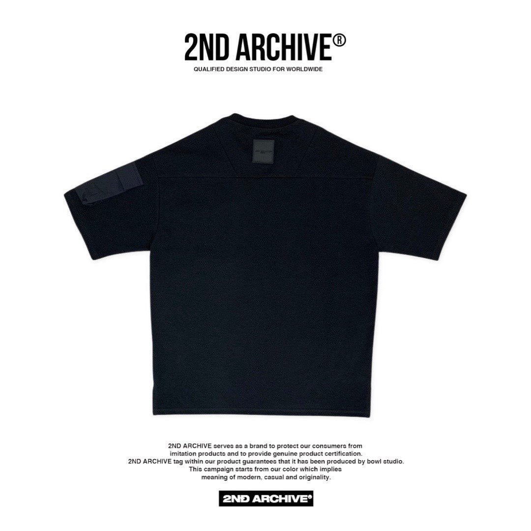 Back facing black t-shirt with small logo. 