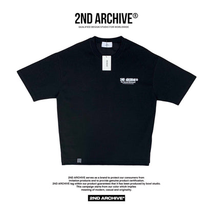 Front facing Korean street fashion black t-shirt with small logo on the chest.