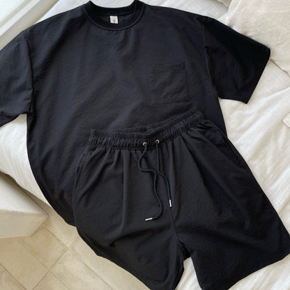 Matching set of black cotton shorts and t shirt made in Korea. 