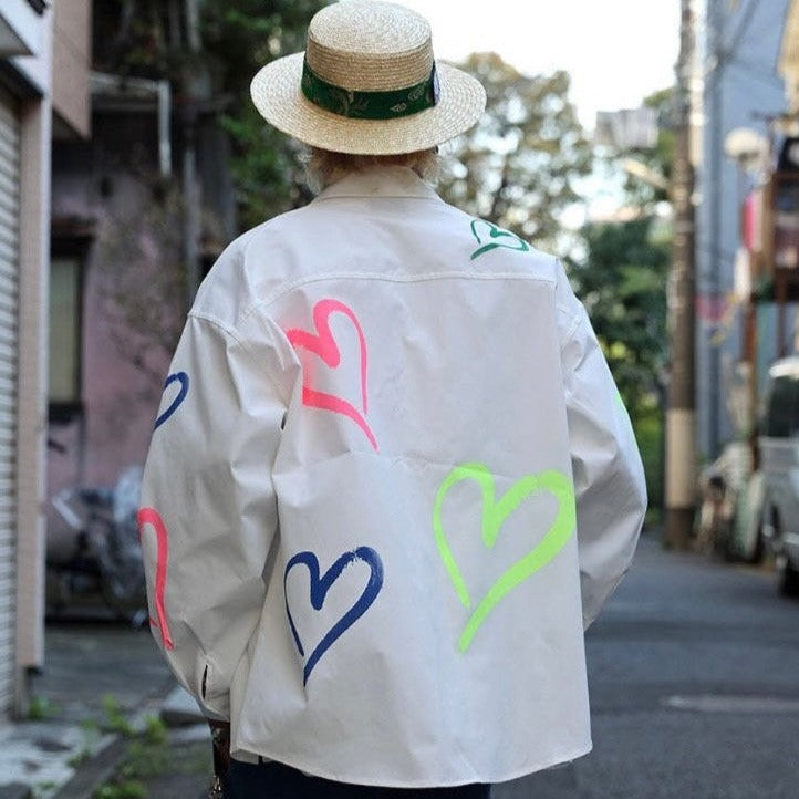 Back view of Korean street fashion collared shirt worn by a model outside. 