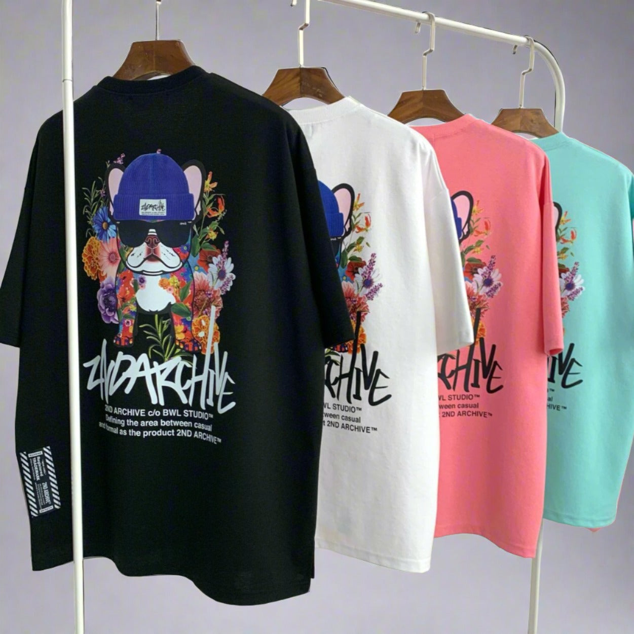 four back facing Korean street fashion graphic t shirts hanging on a rack. 